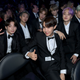 Illustration for article titled The world is crumbling, so heres a nice video of BTS rocking out to Dolly Parton at the Grammys